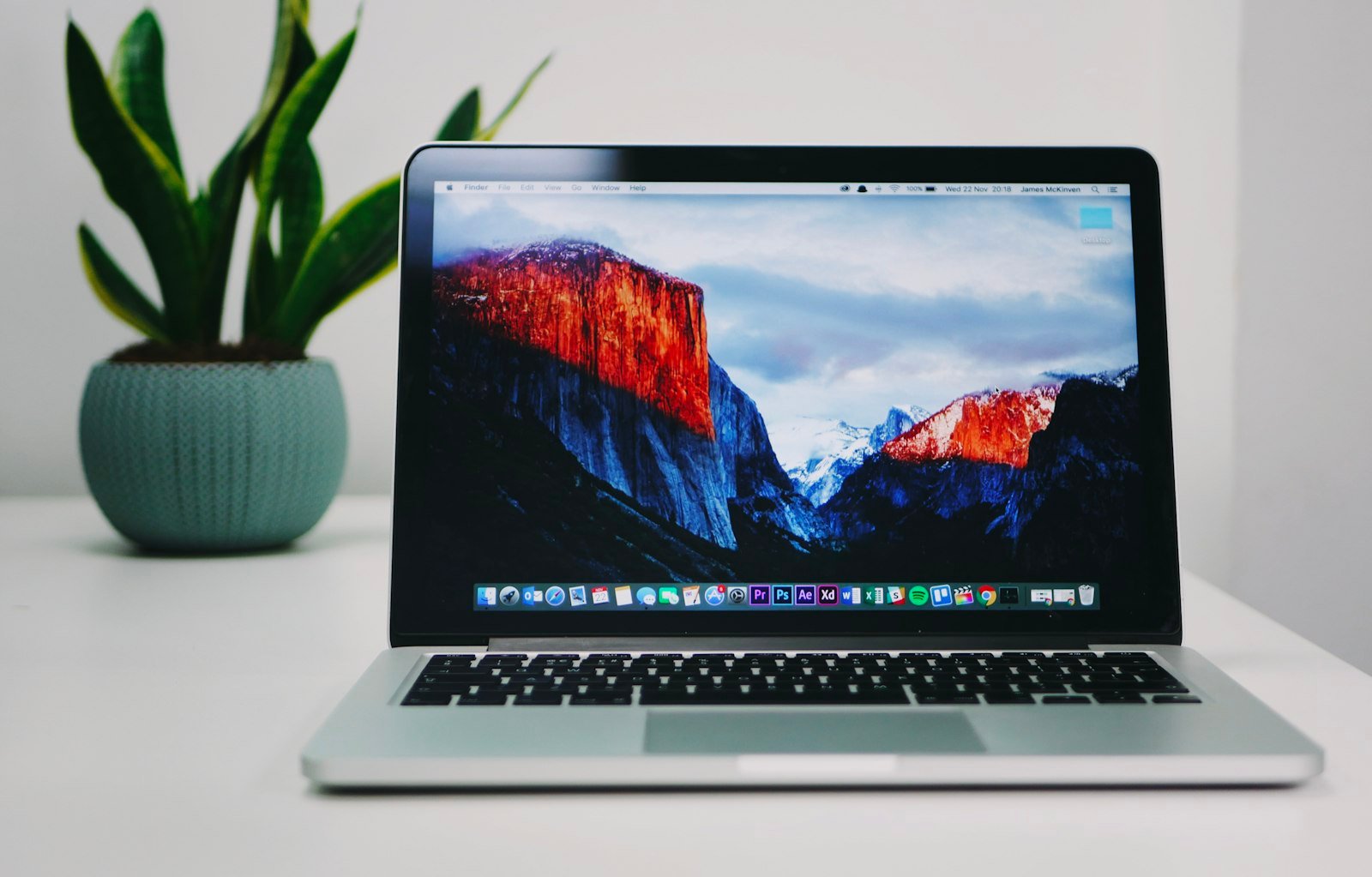Web developer workspace with a MacBook – website development company in Delhi