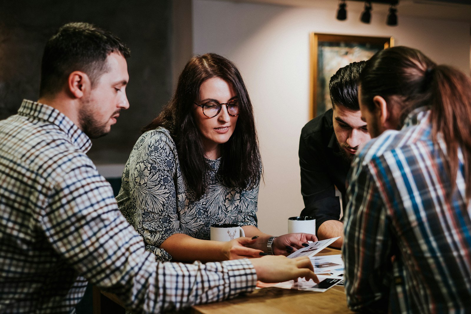 Team reviewing brand research documents – brand strategy agency in Delhi