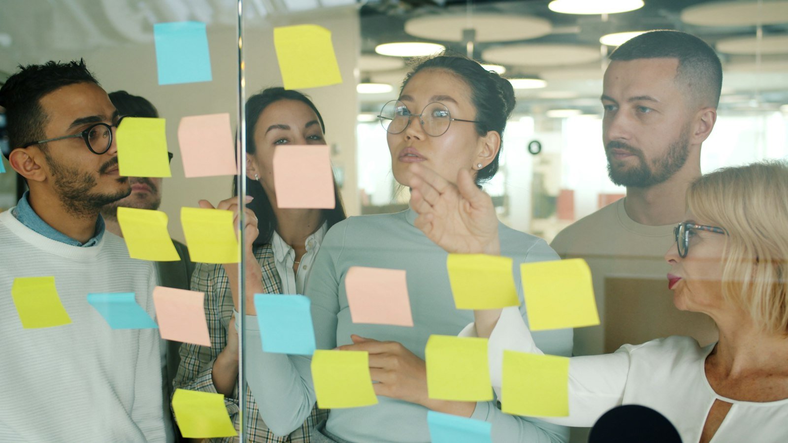 Team working on a naming board – brand naming agency in Delhi
